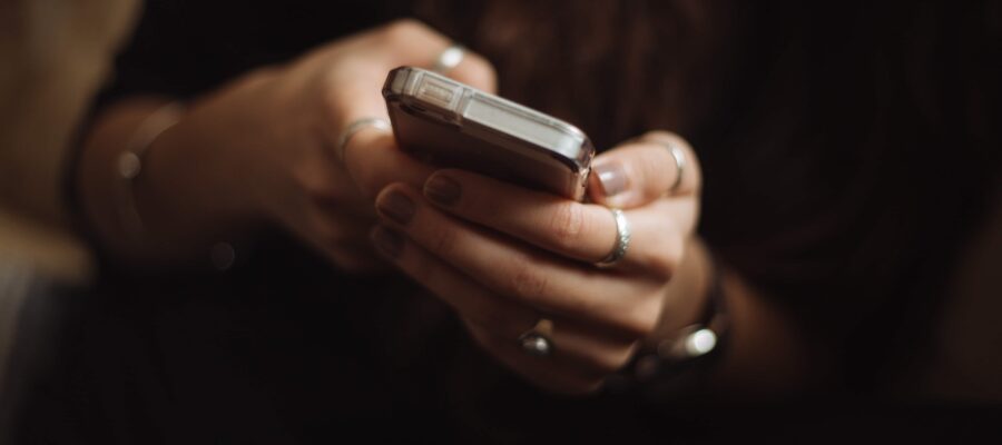 Close up of a woman’s hands using a smart phone