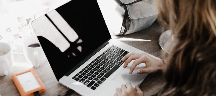 Woman starting a laptop