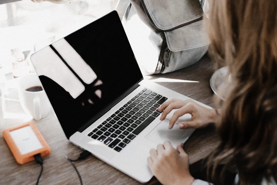 Woman starting a laptop