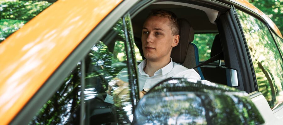 Man driving an electric car