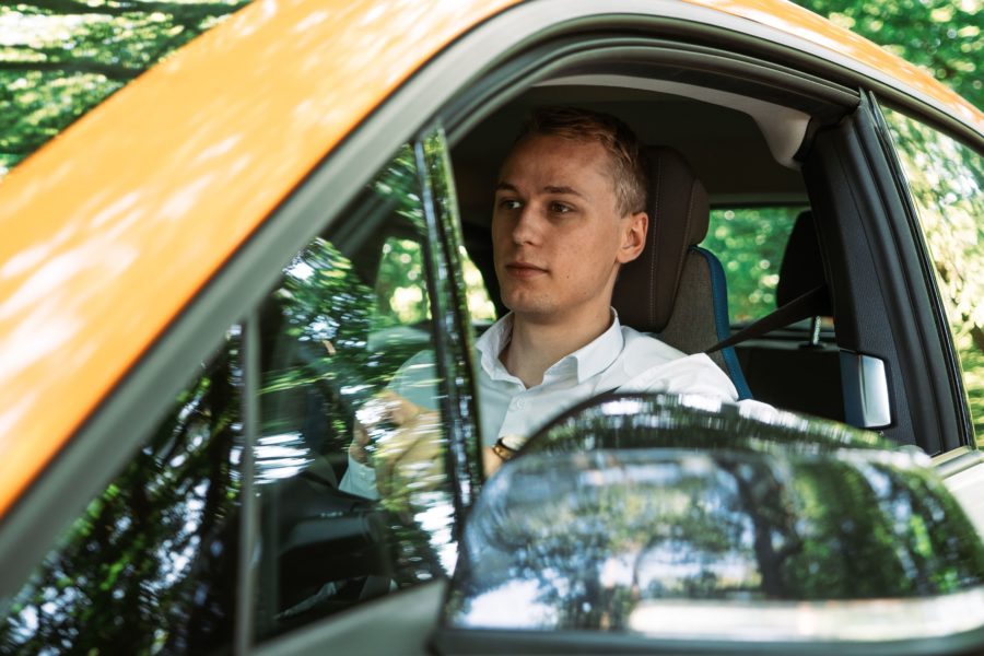 Man driving an electric car