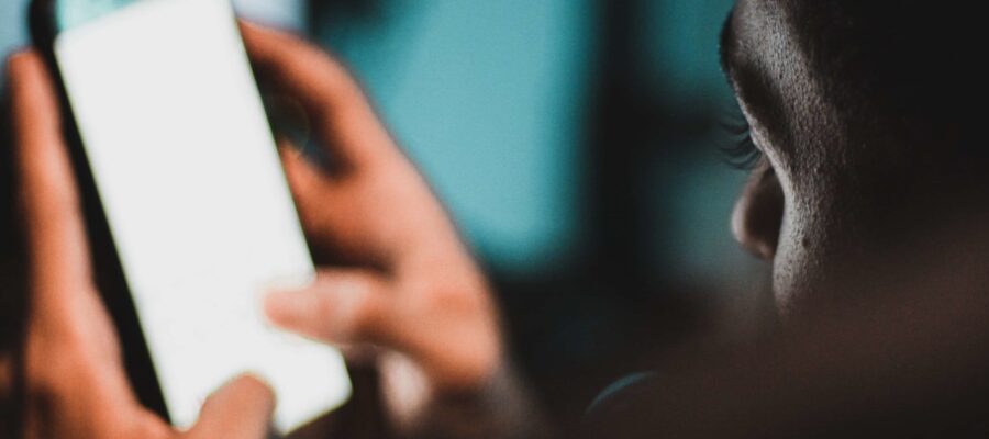 Man looking at phone screen