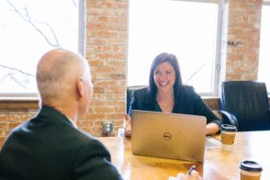 Woman smiles at her colleague