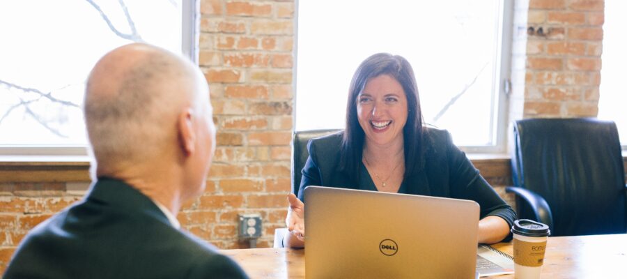 Woman smiles at her colleague