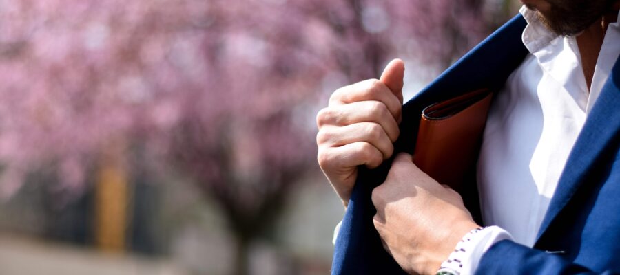 Man putting wallet in pocket