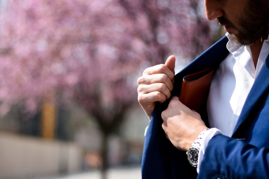 Man putting wallet in pocket