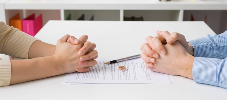 Divorce couples hands on paperwork