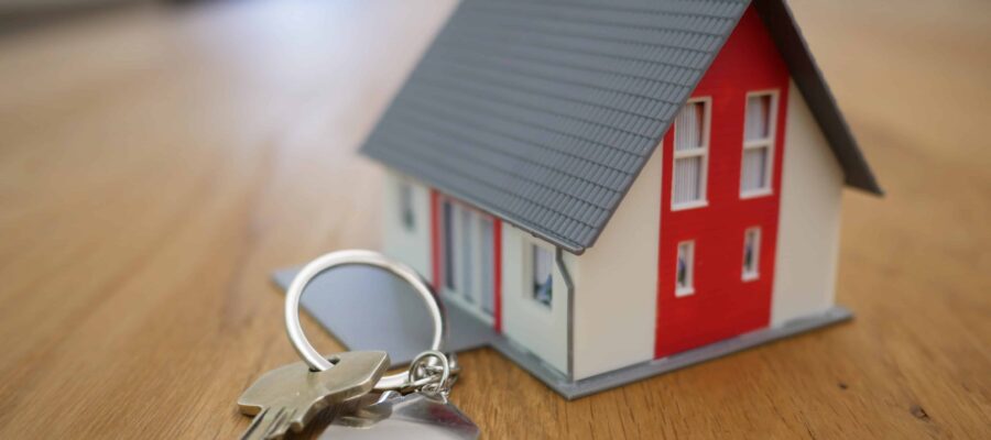 Miniature house with a house key