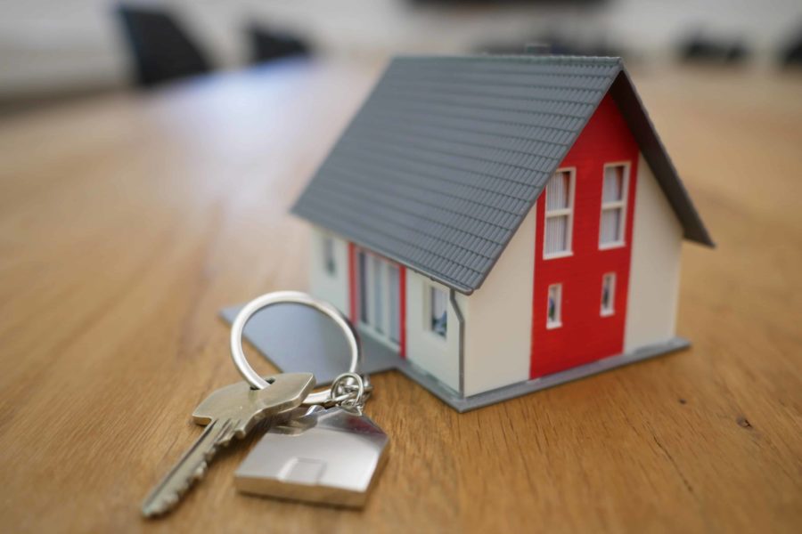 Miniature house with a house key