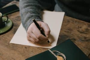 Man writing a gifted deposit letter