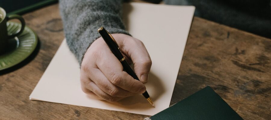 Man writing a gifted deposit letter