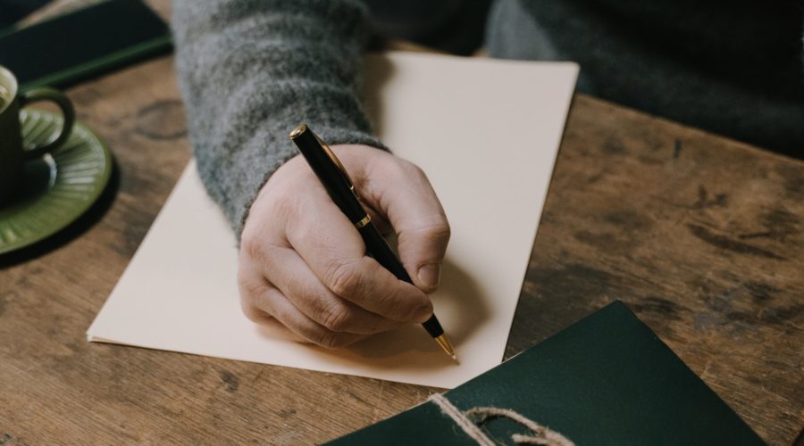 Man writing a gifted deposit letter