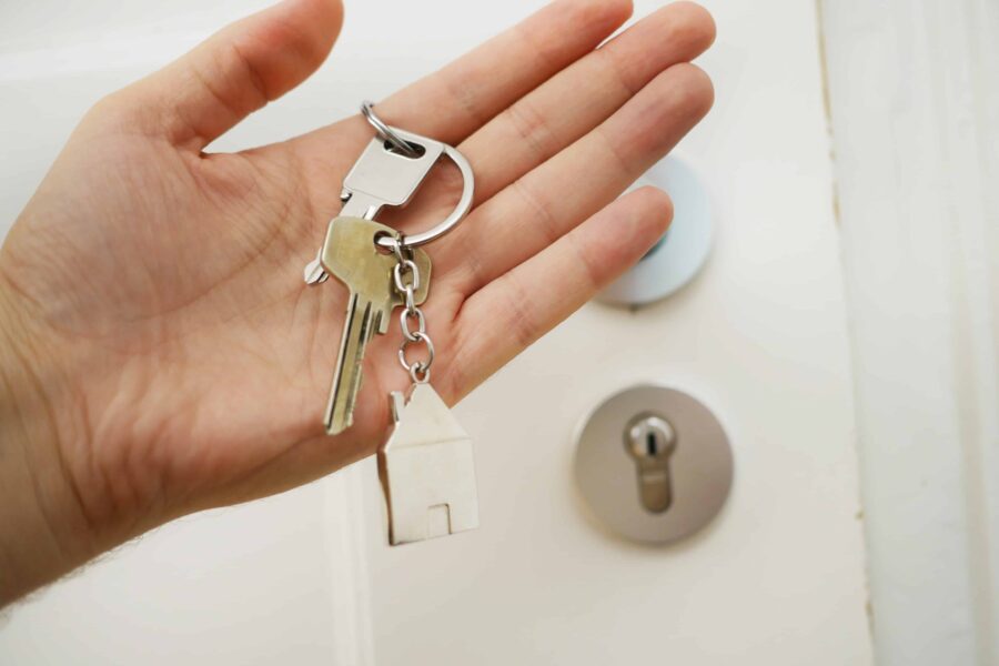 Hand holding house keys