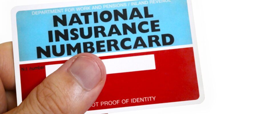Fingers,Of,A,Man,Holding,A,National,Insurance,Number,Card